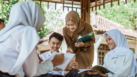 Secondary learners with their teacher