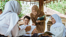 Secondary learners with their teacher