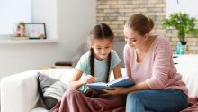 Mother and child reading together