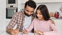 Parents helping child with studying