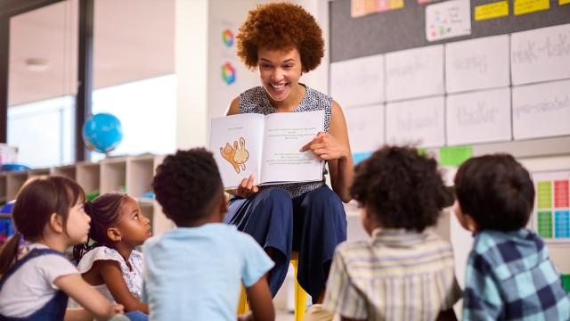 Teacher reading to primary learners